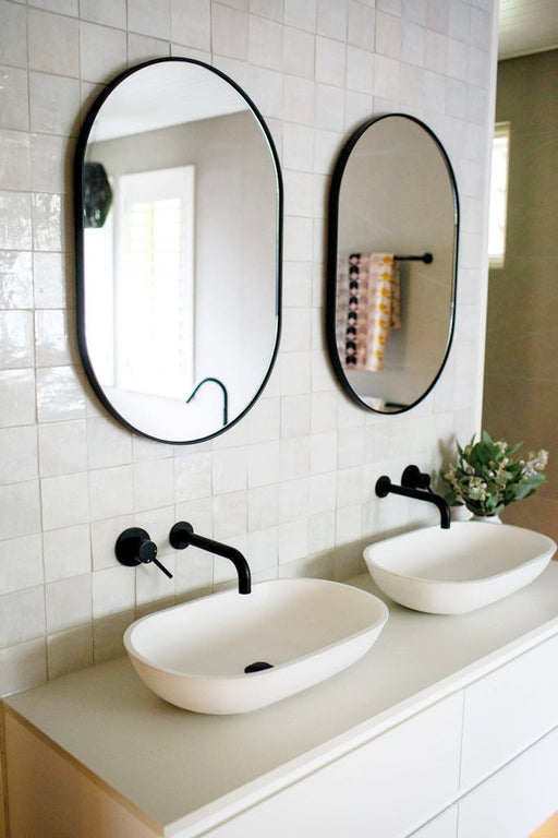 Bjorn Oval mirrors above twin vanity unit
