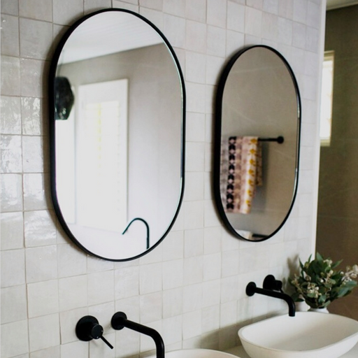 Bjorn Oval mirrors above twin vanity unit
