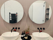 Frameless Round Mirrors over vanity