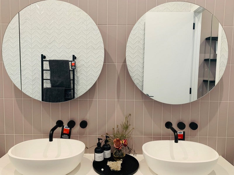 Frameless Round Mirrors over vanity