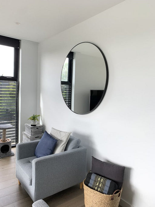 Modern Round Mirror | Bjorn | In a livingroom