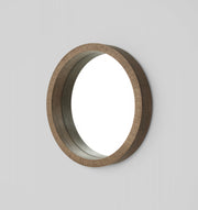 Beautiful, elegant round mirror with a stand out wooden frame. 