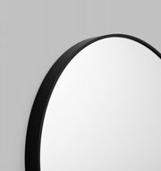 Mat Black Metal Framed mirror, close up. 